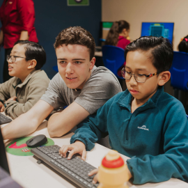 Child being taught by English tutor